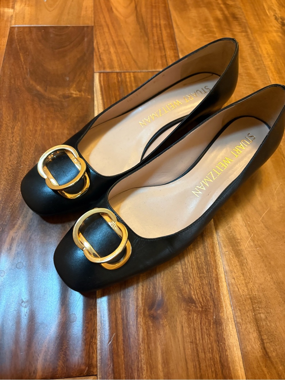 Stuart Weitzman Black Leather Flats with Gold Buckle Detail